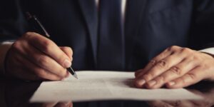 Attorney signing a contract