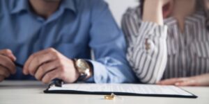 A couple signs divorce paperwork