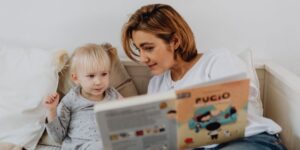 Mom reading to her young daughter