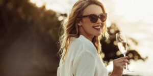 Rich woman holding wine