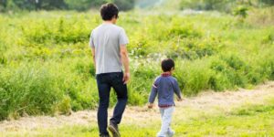 Parent and child walking outside